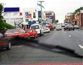 category general-knowledge - You are driving along this road. You hear an ambulance's siren and see the ambulance in your mirror. You should