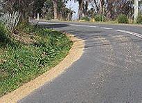 category general-knowledge - You drive up to a corner where you see some loose gravel on the road. You should