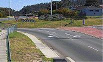 category intersections - When you wish to turn left at a roundabout you indicate: