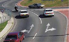 category intersections - When turning left at a roundabout you should enter and leave the roundabout: