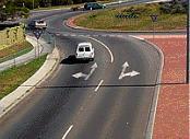 category intersections - You wish to go straight ahead on this roundabout with two lanes. Which lane may you use?
