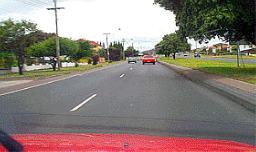 category negligent-driving - The speed limit on this road is 90 km/h. You have just overtaken a vehicle in the left lane. What should you do next?