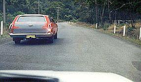 category negligent-driving - When you have started to overtake the car, you notice that its right indicator is flashing. You should: