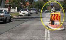 category pedestrians - This person is standing on a pedestrian refuge. If he steps out onto your lane you should: