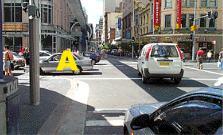 category traffic-lights-lanes - You wish to turn left at this intersection and the traffic lights are green. What should you do?
